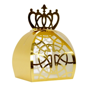 Detail of laser-cut crown candy box with golden mirror finish for wedding favors