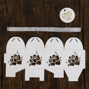 Detailed laser-cut floral paper gift box with grey ribbon and thank you tag