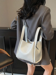 Minimalist light blue crocodile pattern backpack with wide straps and gold hardware studs