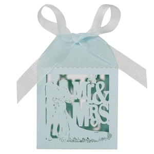 Detail of laser-cut Mr & Mrs blue wedding favor box with a white silk ribbon bow