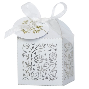 Detail of white laser-cut rose gift box with silk ribbon and Thank You hangtag