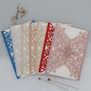 Detailed fan layout showing various colors of glitter laser-cut hollow invitations
