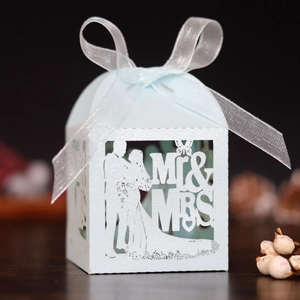 Laser cut light blue wedding favor box with Mr & Mrs silhouette and white organza ribbon