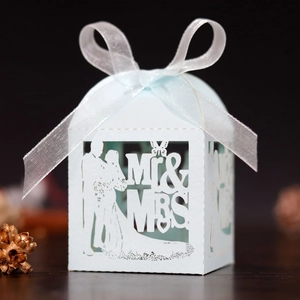 Elegant light blue laser cut wedding favor box with Mr & Mrs motif and white ribbon