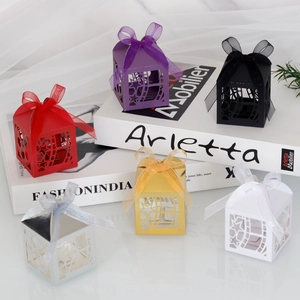 Detail view of hollow star gift boxes in six colors with elegant matching ribbon bows