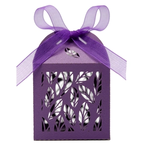 Detailed laser-cut leaf patterns on a purple cardstock favor box with an organza ribbon bow