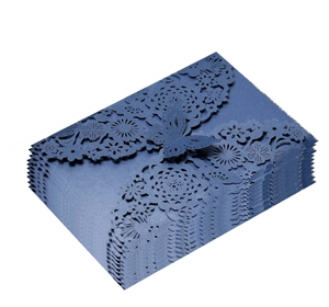 Detail of laser-cut navy blue wedding invitation covers with butterfly floral patterns