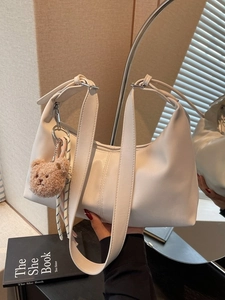 Minimalist white hobo bag with moon silhouette and cute brown plush bear charm