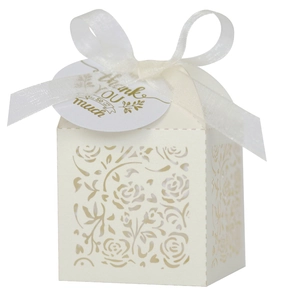 Detailed laser-cut ivory rose gift box with white silk ribbon and Thank You gold tag