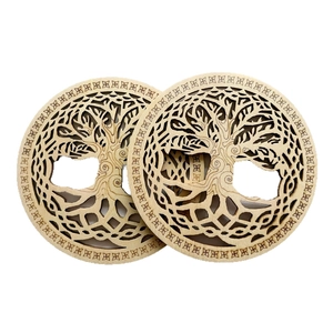 Laser-cut wooden Tree of Life coasters with Celtic knot design on white background