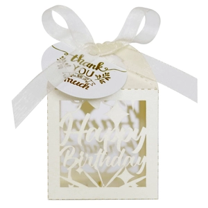 Detail of laser-cut Happy Birthday paper candy box with ribbon and thank you tag