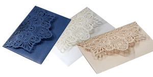 Laser cut lace wedding invitations in navy, cream and pearl champagne gold paper