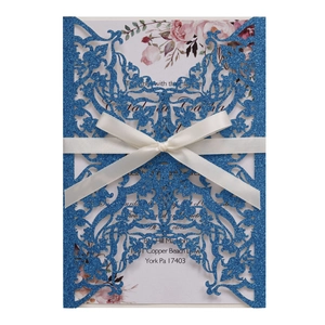 Navy blue laser-cut glitter wedding invitation with ribbon and floral insert card
