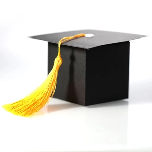 Black graduation cap gift box with a bright yellow tassel for celebration party candy