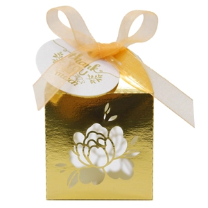 Detailed laser-cut peony pattern on golden gift box with ribbon and thank you tag