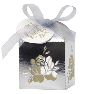 Silver laser cut floral wedding favor box with blue ribbon and thank you tag