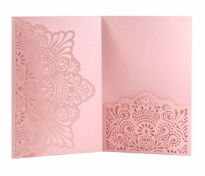 Detail of pink laser-cut invitation holder with intricate floral mandala patterns