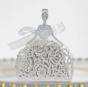 Detail of silver glitter princess candy box with intricate floral cutout and silk bow