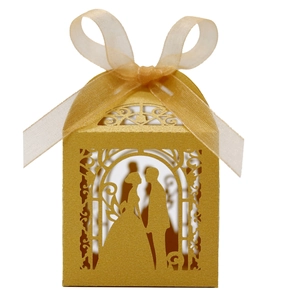 Detailed laser-cut pattern showing a romantic couple on a golden party gift box