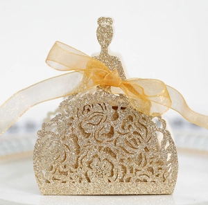 Close-up of golden glitter princess gift box with laser-cut hollowed rose patterns
