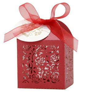 Detail of red laser-cut rose hollow favor box with Thank You tag and silk ribbon