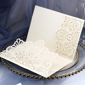 Elegant laser cut hollow lace wedding invitation in cream white pearlescent paper