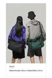 Waterproof travel bags in black and forest green with mesh pockets and adjustable straps