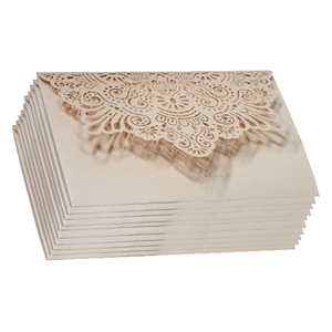Elegant laser-cut floral wedding invitations in champagne gold pearlescent paper