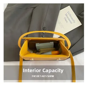Detailed top view of the mustard yellow crossbody bag showing internal storage capacity