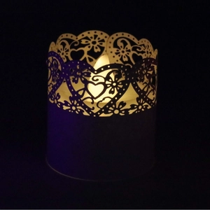 Laser-cut heart pattern LED candle lampshade decorative light with warm yellow glow
