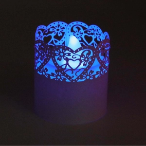 LED heart pattern hollow paper shade candle light with glowing blue festive atmosphere