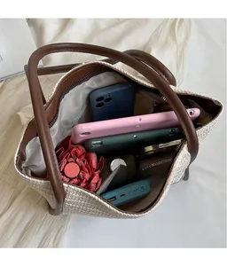 Top-down view of woven tote bag interior showing large capacity for daily items