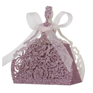 Detail of laser-cut rose hollow purple glitter candy box with a white ribbon bow