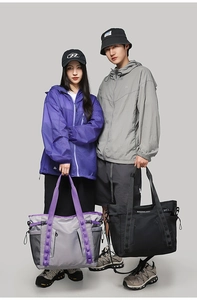 Large waterproof tactical travel tote with side mesh pockets and front zipper pocket