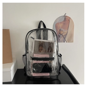 Macro detail of transparent PVC backpack showing side mesh pocket and black strap