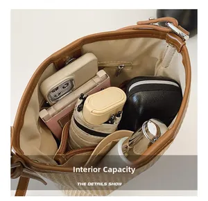 Macro view showing the internal capacity of the woven bag with various daily essentials