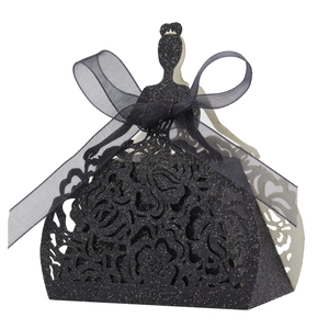 Detail of laser-cut hollow dress-shaped wedding candy box with black glitter finish