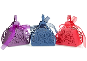 Detailed laser-cut princess dress candy boxes with floral hollow patterns and satin bows