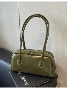 Olive green leather underarm bag with white stitching and long shoulder strap