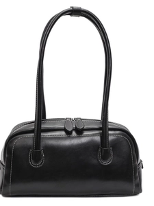 Minimalist black leather underarm pillow bag with white contrast stitching details