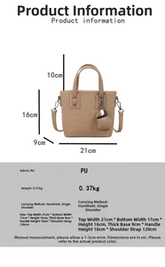 Detail view of beige crocodile embossed bucket bag with silver hardware and size specifications