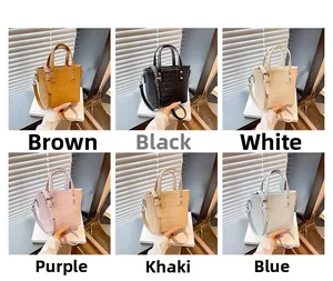 Detail showing various colors of crocodile embossed PU leather bucket handbags