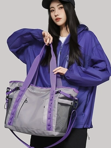 Grey waterproof large capacity travel bag with purple straps and side mesh pocket
