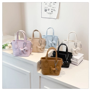 Detail view of stylish crocodile pattern handbags in six colors with dog charms