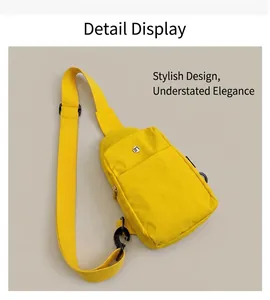 Detail view of yellow nylon crossbody bag with adjustable strap and metallic logo