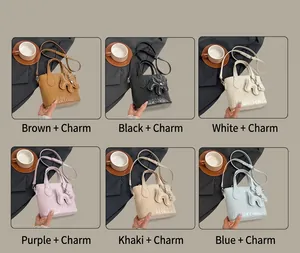 Collage of crocodile pattern bucket bags in six colors with matching padded pendants