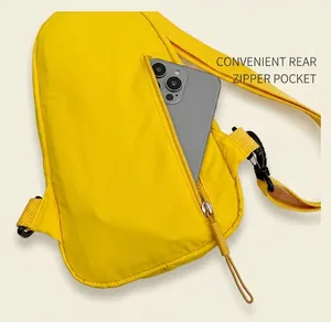 Detailed back view of yellow nylon crossbody bag showing the functional hidden zipper pocket