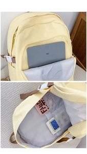 Détail du compartiment principal du sac à dos jaune clair avec pochette pour ordinateur