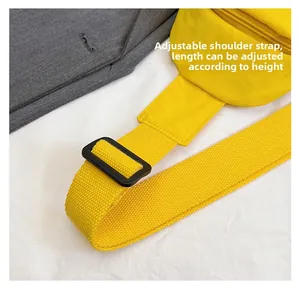 Detail showing the adjustable high-density nylon shoulder strap and buckle on yellow bag