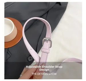 Detail of lavender leather adjustable shoulder strap with silver buckle and fine stitching